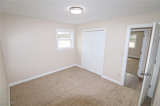 757 Eastern Rd, Doylestown, OH 44230 - unfurnished bedroom with carpet floors, baseboards, and multiple windows