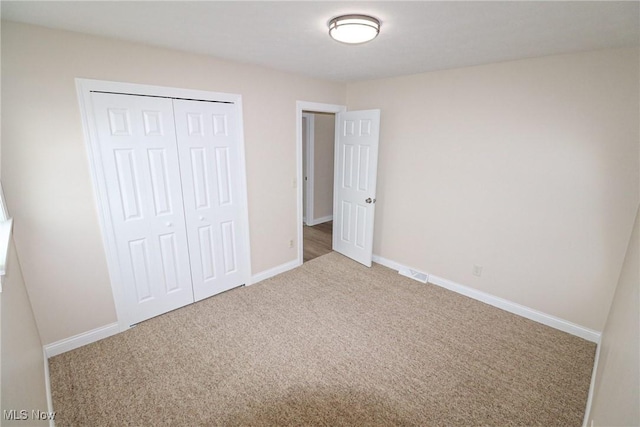 757 Eastern Rd, Doylestown, OH 44230 - unfurnished bedroom featuring carpet, a closet, and baseboards