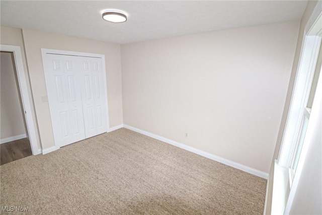 757 Eastern Rd, Doylestown, OH 44230 - unfurnished bedroom with baseboards, carpet floors, and a closet