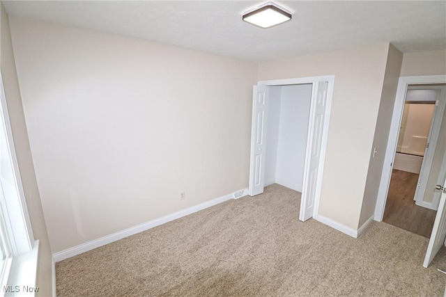 757 Eastern Rd, Doylestown, OH 44230 - unfurnished bedroom with baseboards, a closet, and carpet