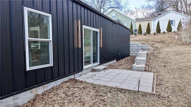 view of property exterior with a patio