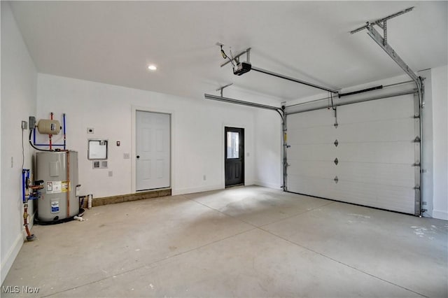 garage with baseboards, electric water heater, and a garage door opener