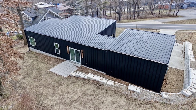 back of property with metal roof