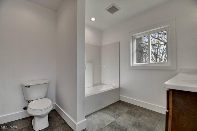 bathroom with shower / bath combination, visible vents, toilet, vanity, and baseboards