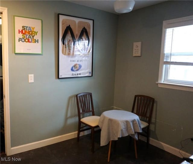 dining area featuring baseboards