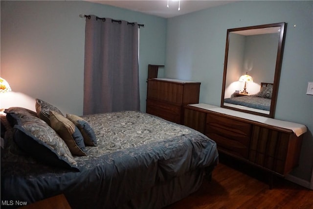 bedroom featuring wood finished floors