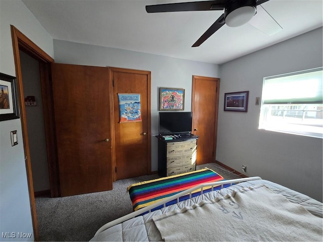 carpeted bedroom featuring ceiling fan