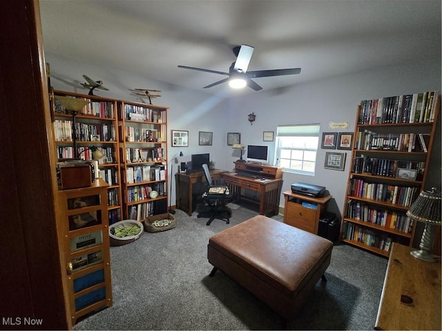 carpeted office space with a ceiling fan