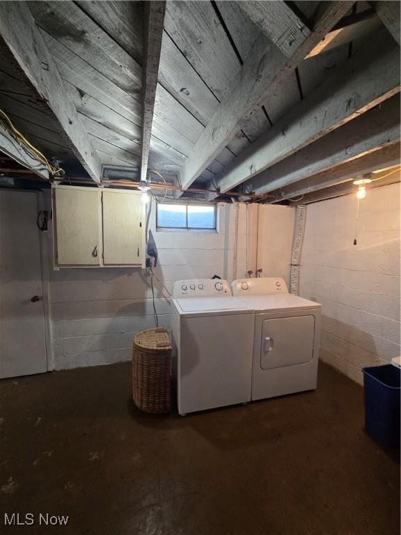 below grade area with washer and clothes dryer