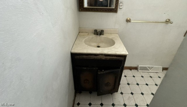 bathroom featuring visible vents and vanity