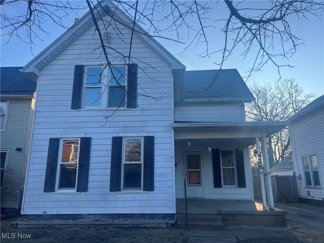 traditional home featuring covered porch