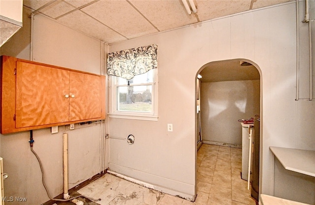 clothes washing area with arched walkways