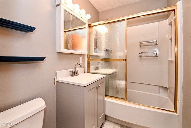 bathroom with toilet, shower / bath combination with glass door, and vanity