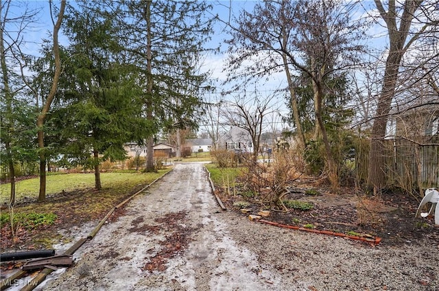 view of street featuring dirt driveway