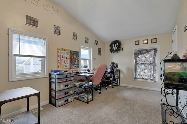 home office featuring carpet floors, visible vents, baseboards, and vaulted ceiling