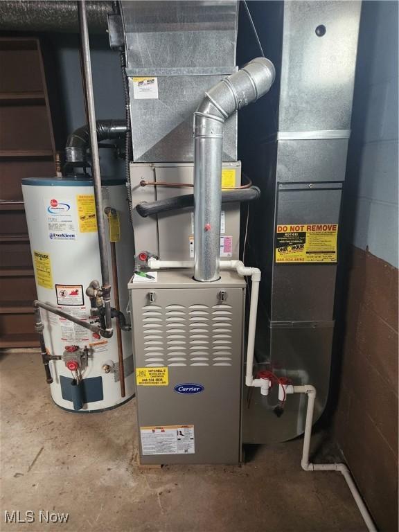 utility room with water heater