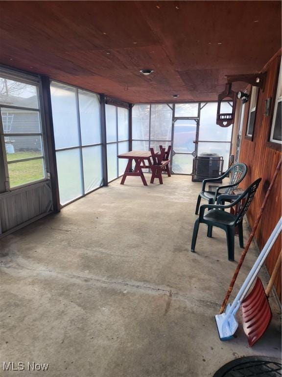 sunroom / solarium featuring wooden ceiling