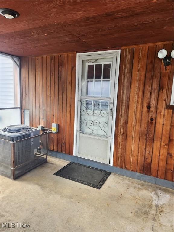 doorway to property featuring cooling unit