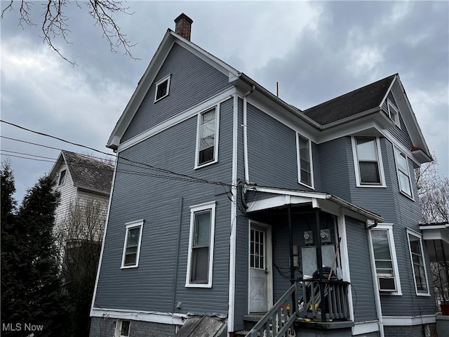 exterior space featuring a chimney