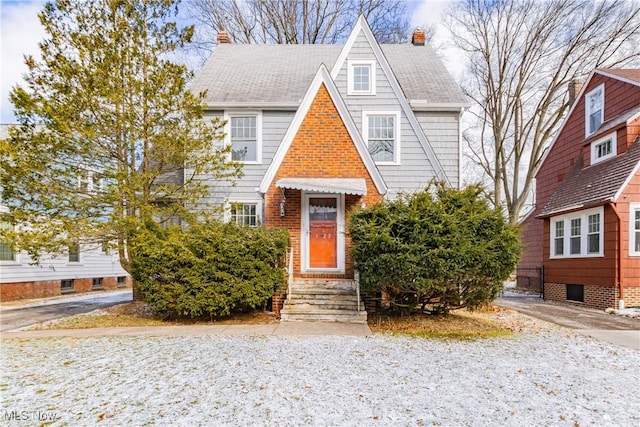 view of front of home featuring roof with shingles