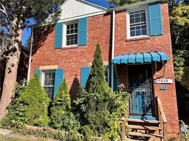 view of front of home featuring brick siding