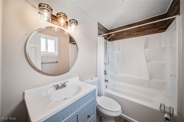 bathroom with a textured ceiling, vanity, toilet, and shower / bathtub combination with curtain