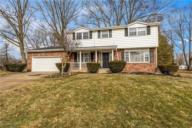 view of front of house featuring brick siding, covered porch, concrete driveway, an attached garage, and a front yard