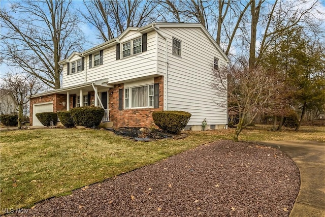 view of side of property with an attached garage, a yard, and brick siding