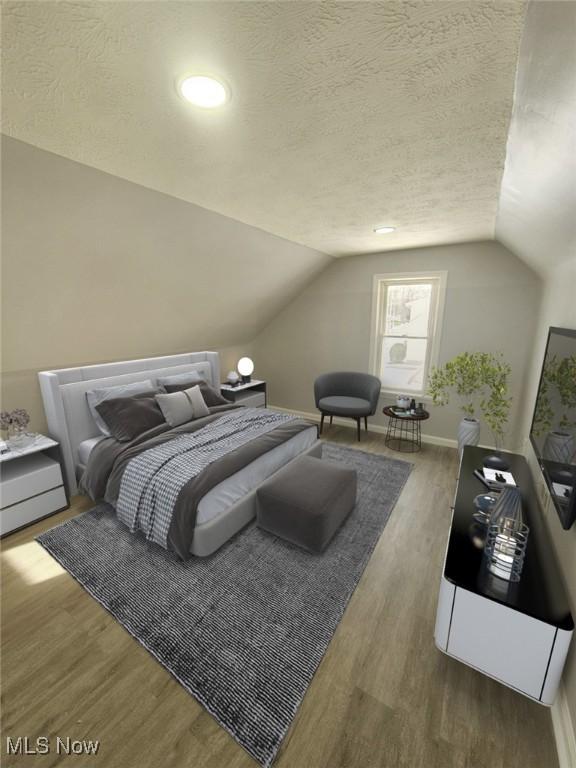 bedroom with a textured ceiling, vaulted ceiling, wood finished floors, and baseboards