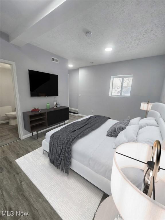 bedroom featuring a textured ceiling, recessed lighting, wood finished floors, visible vents, and baseboards