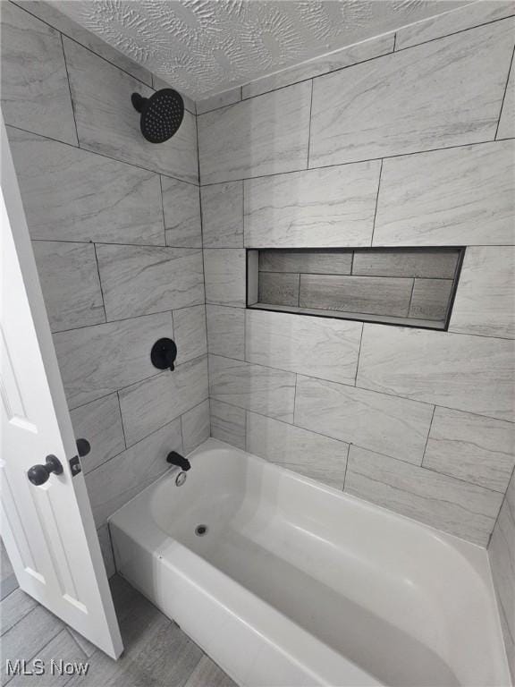 full bathroom with tub / shower combination and wood finished floors