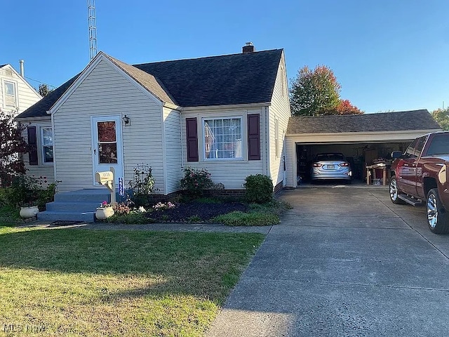 view of front of property with a garage, roof with shingles, a chimney, and a front yard