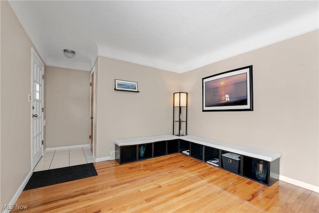 entryway featuring light wood-style floors and baseboards