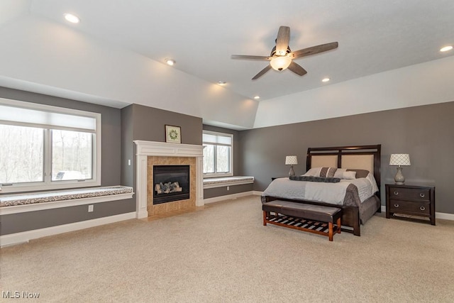 bedroom with lofted ceiling, light colored carpet, baseboards, and recessed lighting