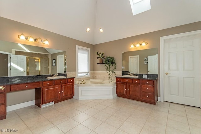 full bath with lofted ceiling with skylight, a sink, a bath, and a shower stall