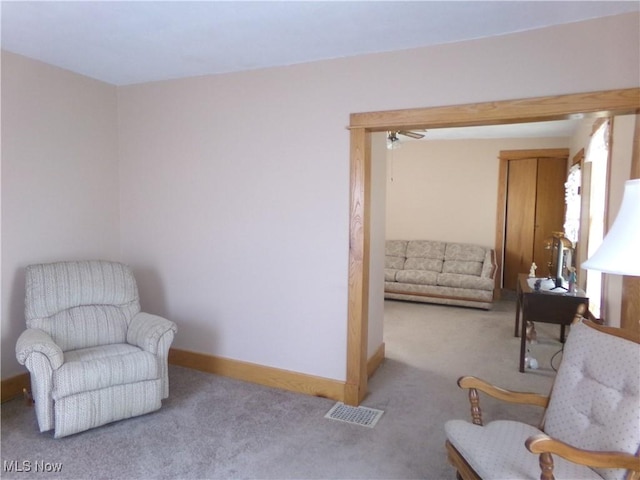 sitting room featuring carpet, visible vents, and baseboards