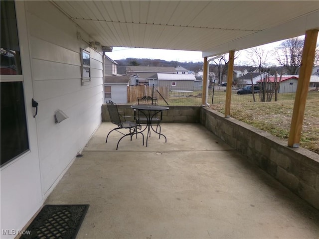 view of patio / terrace with outdoor dining area and fence