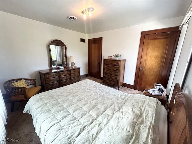 bedroom with visible vents and baseboards