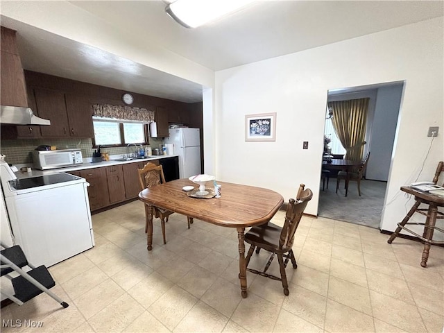 dining space with baseboards