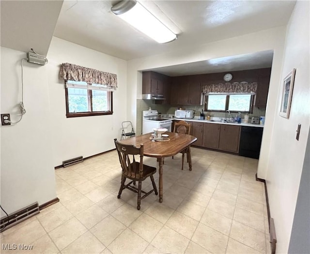 dining room with plenty of natural light and baseboards