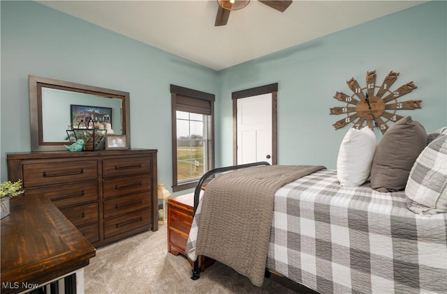 bedroom featuring light carpet and ceiling fan