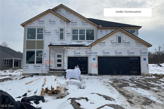 property in mid-construction with an attached garage