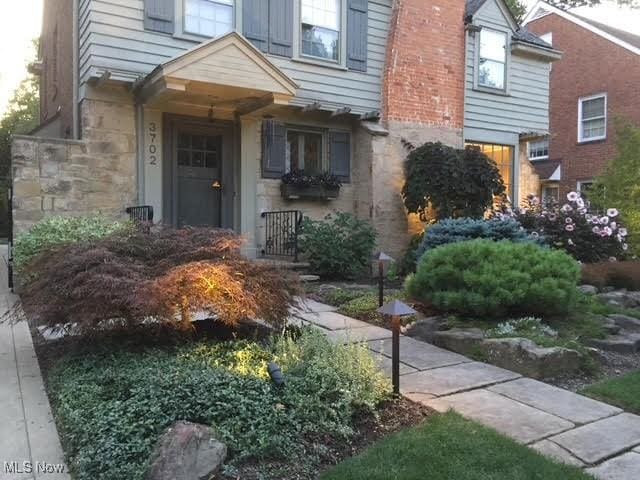 entrance to property featuring stone siding