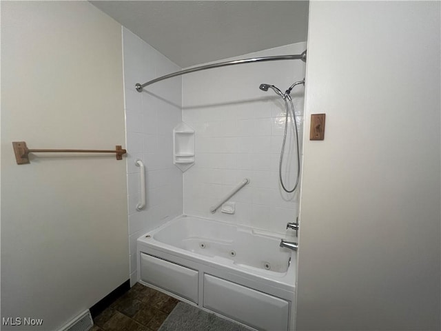 bathroom featuring a combined bath / shower with jetted tub