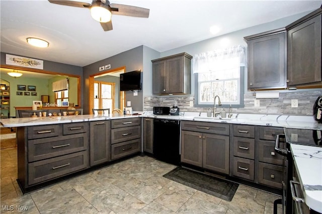 kitchen with tasteful backsplash, a ceiling fan, a sink, a peninsula, and black appliances