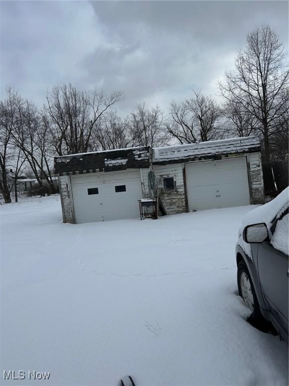 view of snow covered garage