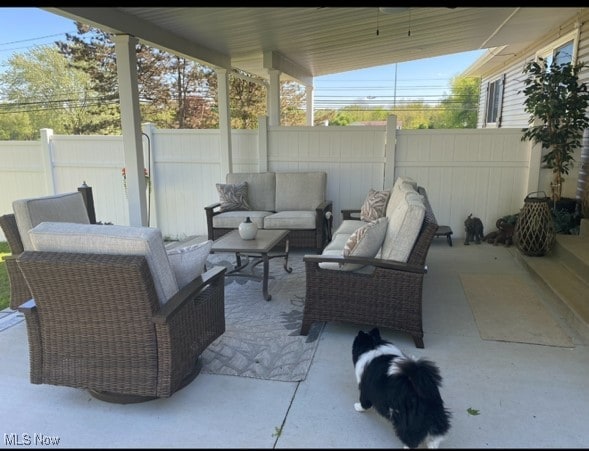 view of patio / terrace featuring a fenced backyard and an outdoor living space