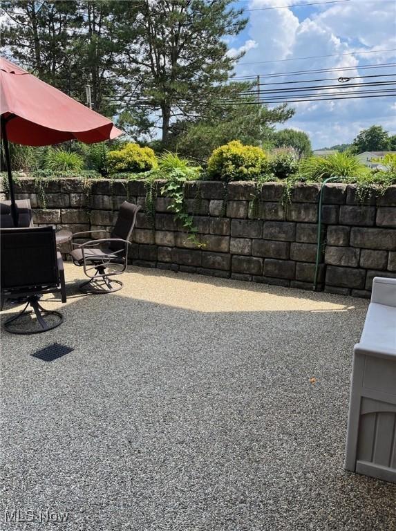 view of yard featuring a patio and fence