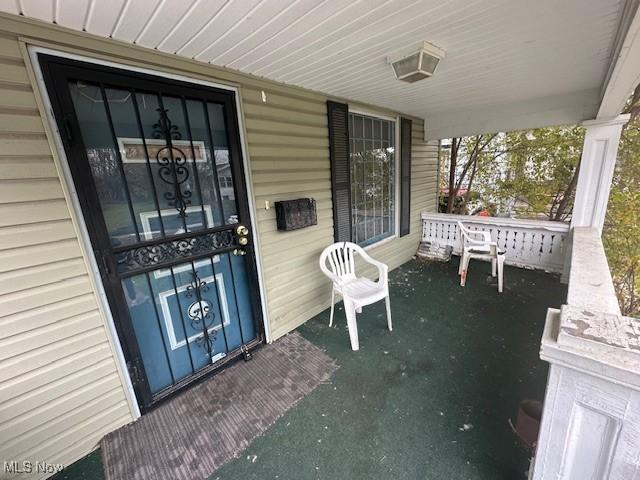 doorway to property with a porch