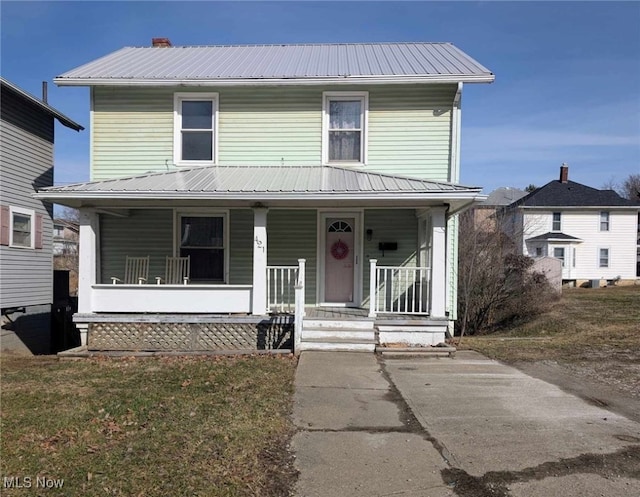 view of front of house featuring a porch and metal roof